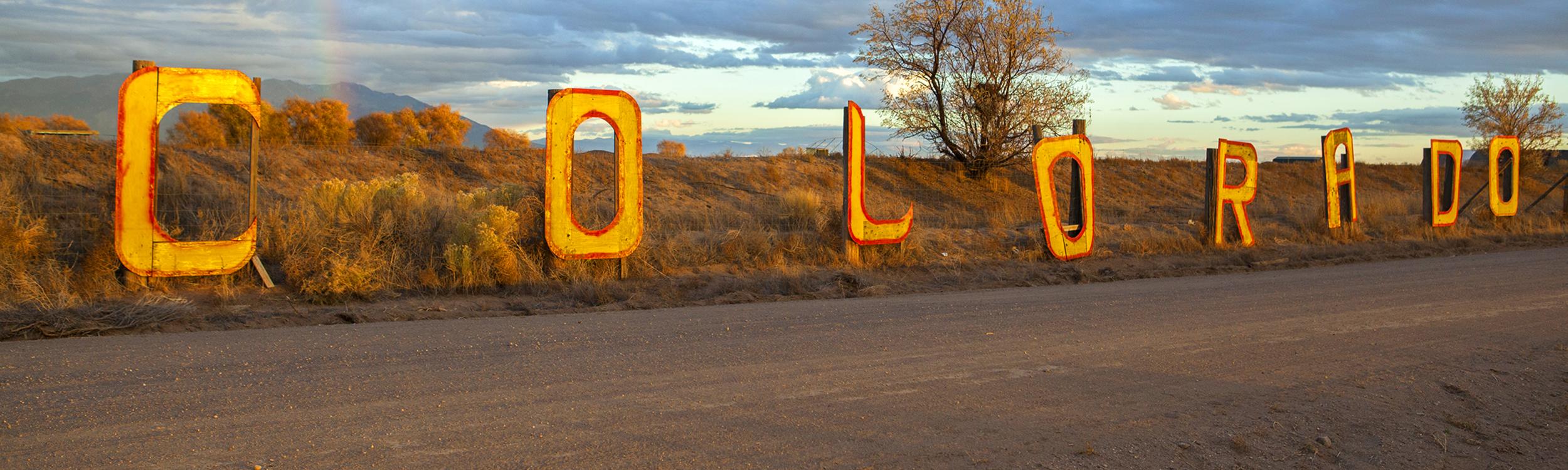 Colorado sign against scenic backdrop