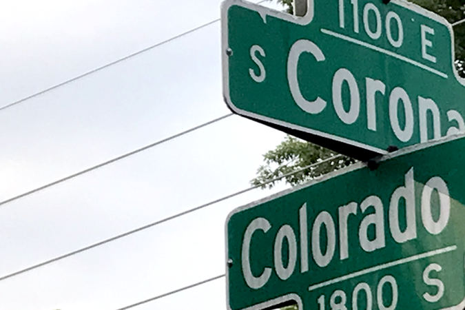 Street signs at the intersection of Corona Street and Colorado Avenue