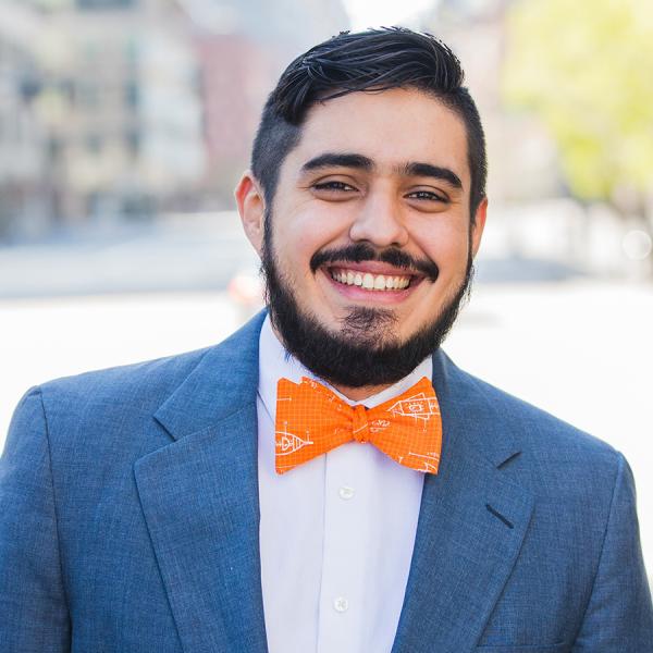 Man with blue jacket and orange bowtie