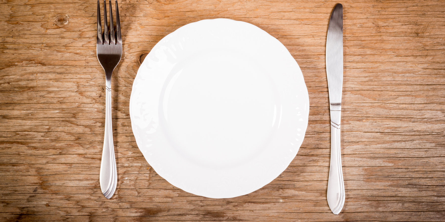 Empty plate knife and fork.