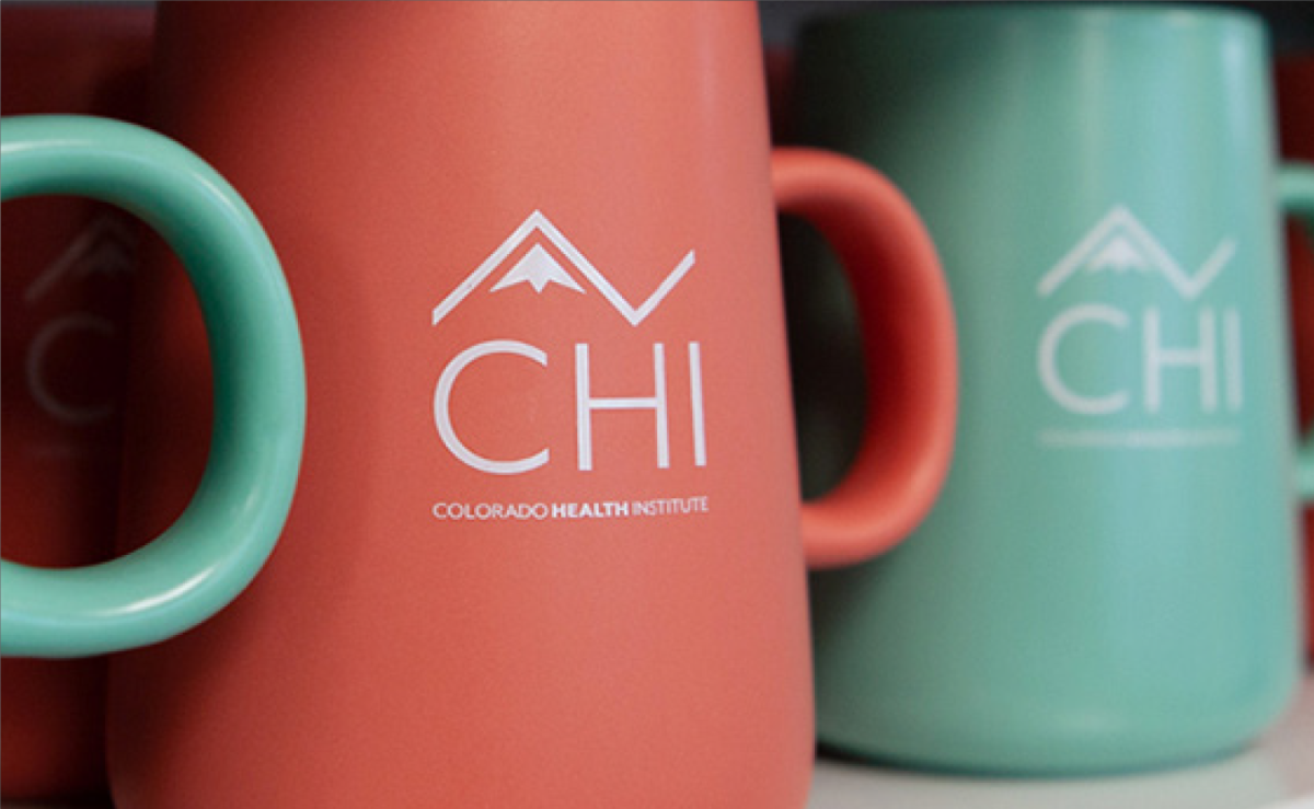 CHI logo on a coffee mug